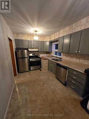 Mississauga (Mineola) apartment for rent - A kitchen with granite countertops and stainless steel appliances.