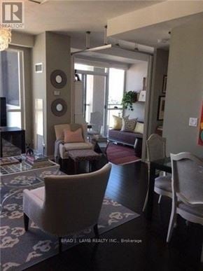 Toronto (Niagara) condo for rent - A living room with a couch, chairs, and a rug.
