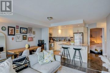 Toronto (Waterfront Communities) condo for rent - A well-lit, modern kitchen and living room with a dining table and chairs.