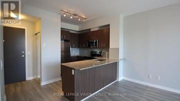 Richmond Hill (Jefferson) condo for rent - A kitchen with a counter top and cabinets.