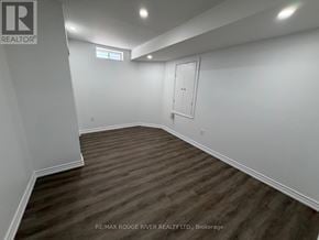 Markham (Greensborough) apartment for rent - A room with wooden flooring and white walls, with a door and a window.