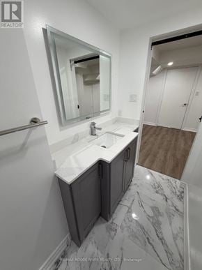 Markham (Greensborough) apartment for rent - A bathroom with a marble floor and a white sink.