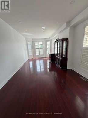 Markham (Greensborough) apartment for rent - A long hallway with wood floors and white walls.