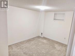 Barrie (Painswick South) apartment for rent - A room with a carpeted floor and a window with blinds.