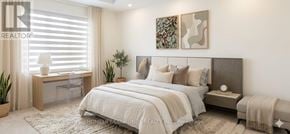 Brampton (Goreway Drive Corridor) townhouse for rent - A bedroom with a large bed, a desk with a chair, and a window with blinds.