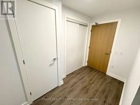 Vaughan (Vaughan Corporate Centre) condo for rent - A room with a white door and a brown door.