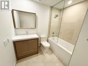 Vaughan (Vaughan Corporate Centre) condo for rent - A bathroom with a toilet, sink, and bathtub.