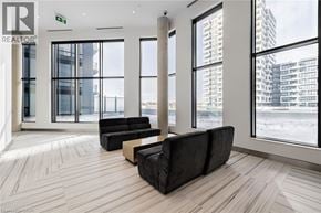 Unionville condo for rent - A living room with a couch and a window overlooking a city.