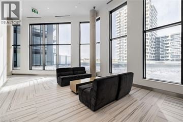 Unionville condo for rent - A living room with a couch and a window overlooking a city.