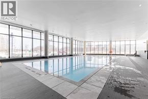 Unionville condo for rent - A large indoor swimming pool with a glass wall surrounding it.