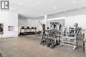 Unionville condo for rent - A gym with a variety of equipment including weights and a treadmill.