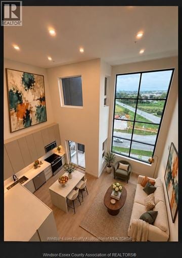 Lasalle condo for rent - A living room with a view of the street outside the window.