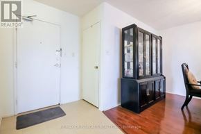 Toronto (L'amoreaux) condo for rent - A black cabinet with glass doors sits in a room with white walls.