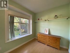 Burnaby apartment for rent - A room with a window and a dresser.