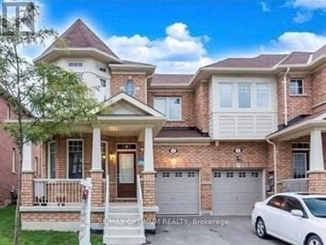 Brampton (Bram West) townhouse for rent - A two-story house with a white car parked in front.