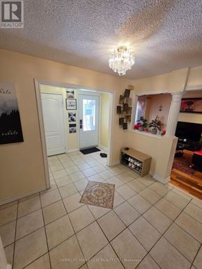 Brampton (Heart Lake West) apartment for rent - A foyer with a rug and a chandelier.