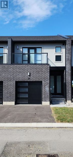 Welland (Lincoln/Crowland) townhouse for rent - A modern house with a black door and windows.