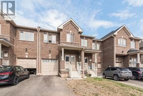 Thorold (Thorold Downtown) townhouse for rent - A row of houses with cars parked in front.