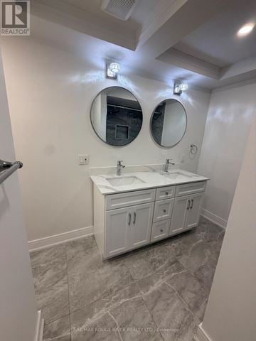 Whitby (Downtown Whitby) apartment for rent - A bathroom with a vanity and two mirrors.