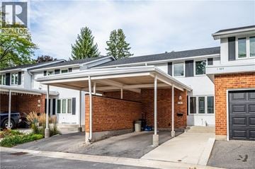 Waterloo townhouse for rent - A two-story house with a covered garage.
