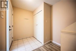 Waterloo townhouse for rent - A room with a white door and a white cabinet.