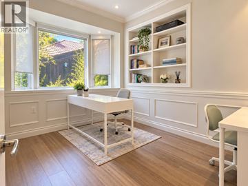 West Vancouver apartment for rent - A white desk with a chair and a bookshelf in a room.
