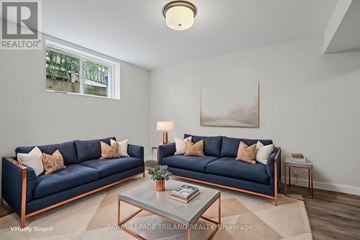 London South (South E) apartment for rent - A living room with two blue couches and a coffee table.
