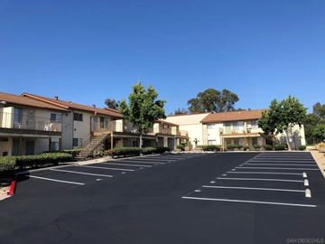 San Ysidro apartment for rent - A parking lot with several cars parked in it.