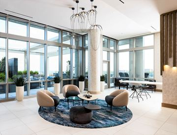 Alexandria apartment for rent - A modern living room with a large table and chairs.