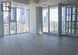 Toronto (Church-Yonge Corridor) condo for rent - A spacious room with a view of the cityscape outside the large windows.