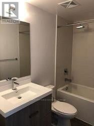 Toronto (Church-Yonge Corridor) condo for rent - A white sink and toilet in a small bathroom.