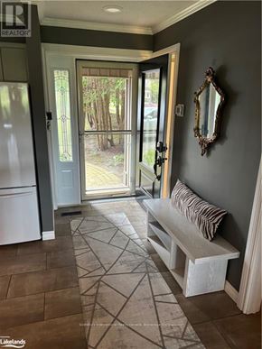 Collingwood townhouse for rent - A bench is placed in the middle of a hallway.