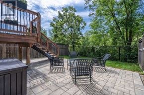 Burlington (Alton) apartment for rent - A patio with a table and chairs and a deck with a railing.