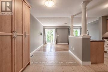 Burlington (Alton) apartment for rent - A spacious kitchen with wooden cabinets and a large island.