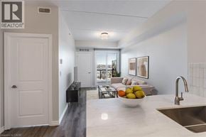 Milton condo for rent - A kitchen with a sink, counter, and a bowl of fruit.