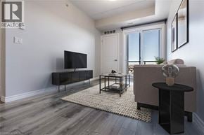 Milton condo for rent - A living room with a flat screen TV and a large window.