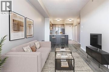 Milton condo for rent - A living room with a grey couch and a coffee table.