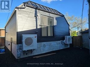Toronto (Keelesdale-Eglinton West) apartment for rent - A mobile home with a white air conditioning unit on the side.