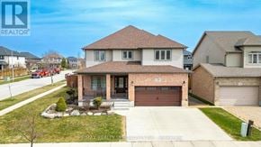 Woodstock (Woodstock - North) apartment for rent - A house with a brown roof and a garage door is for sale.