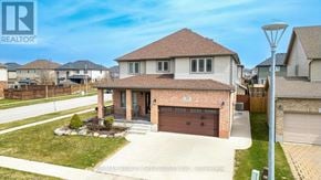 Woodstock (Woodstock - North) apartment for rent - A house with a brown roof and a garage door is for sale.