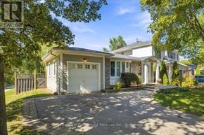 Oakville (Oo Old Oakville) apartment for rent - A house with a driveway and garage is for sale.
