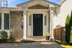 Oakville (Oo Old Oakville) apartment for rent - A house with a black front door and a stone pillar.