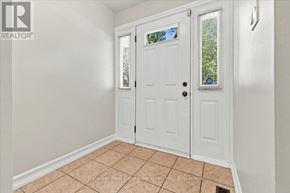 Oakville (Oo Old Oakville) apartment for rent - A white door with a glass window is in a room with a tiled floor.