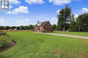 Blandford-Blenheim apartment for rent - A house with a lawn in front of it.