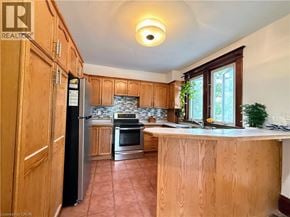 Cambridge apartment for rent - A kitchen with wooden cabinets and a refrigerator.