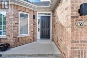 Caledon (Caledon East) apartment for rent - A brick house with a black door and a window.