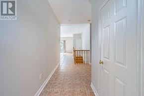 Caledon (Caledon East) apartment for rent - A hallway with a tiled floor and white walls.