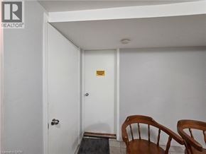 Waterloo apartment for rent - A room with a door and a yellow sign on it.
