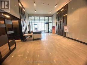 Markham (Unionville) condo for rent - A spacious office lobby with a reception desk and a large window.