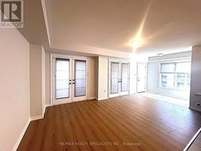 Brampton (Northwest Brampton) townhouse for rent - A room with wooden floors and white walls, with a window on the right side.